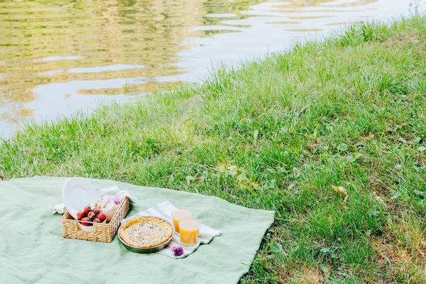 Morning picnic in the park. Tasty food. Snacks and fruits. Picnic basket. Lifestyles.