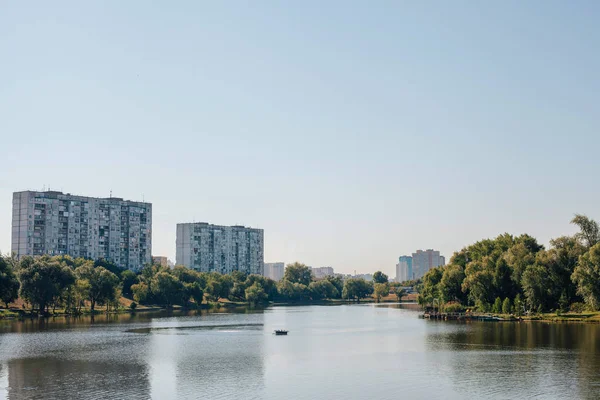 Big lake. High buildings of the city. High-rise buildings. Beach.