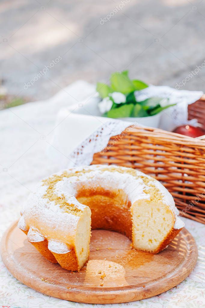 Summer picnic. Basket with food. Sweet desserts.