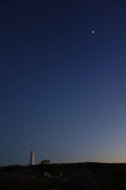 Kıbrıs fenerinin üzerinde gün batımı