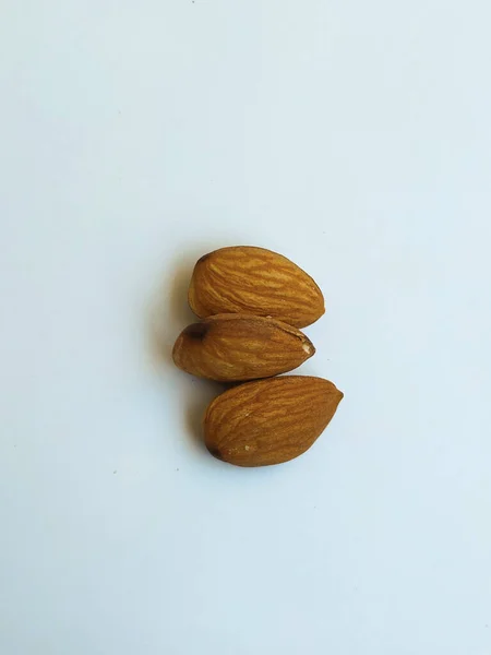 Closeup Three Almond Nuts Isolated White Background — Stock Photo, Image