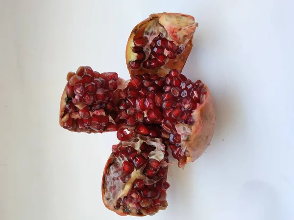 Closeup Pomegranate Fruit Sliced Four Section Isolated White Background — Stock Photo, Image