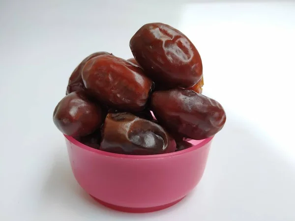 Closeup Raw Dry Dates Brown Color Fruit Plastic Pink Bowl — Stock Photo, Image