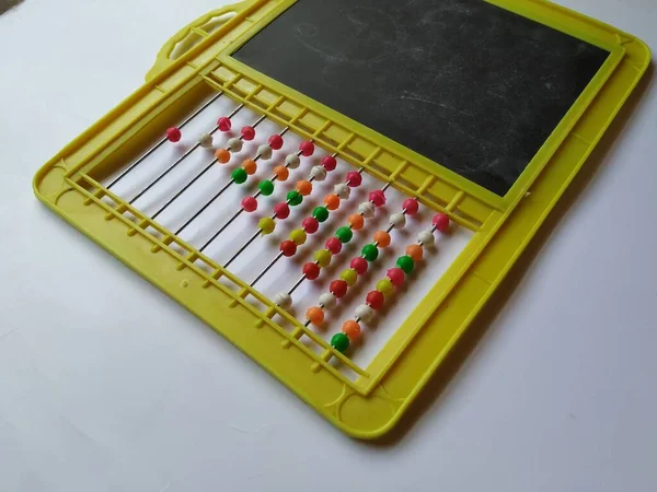 Closeup Plastic Colorful Beeds Abacus Black Board Slate Chalk Piece — стокове фото
