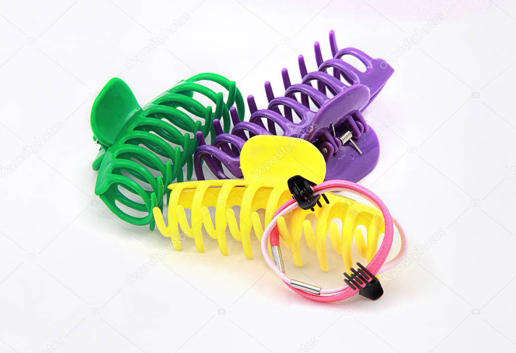 Colourful crab hair clips on a white background 