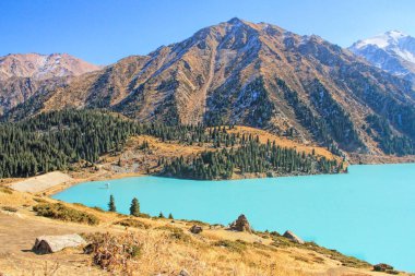 Spectacular scenic Big Almaty Lake in theTien Shan Mountains in Almaty, Kazakhstan, Central Asia  clipart