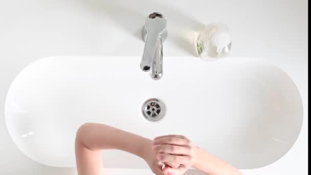 Boy washing his hands after playing to fight the coronavirus — Stock Video