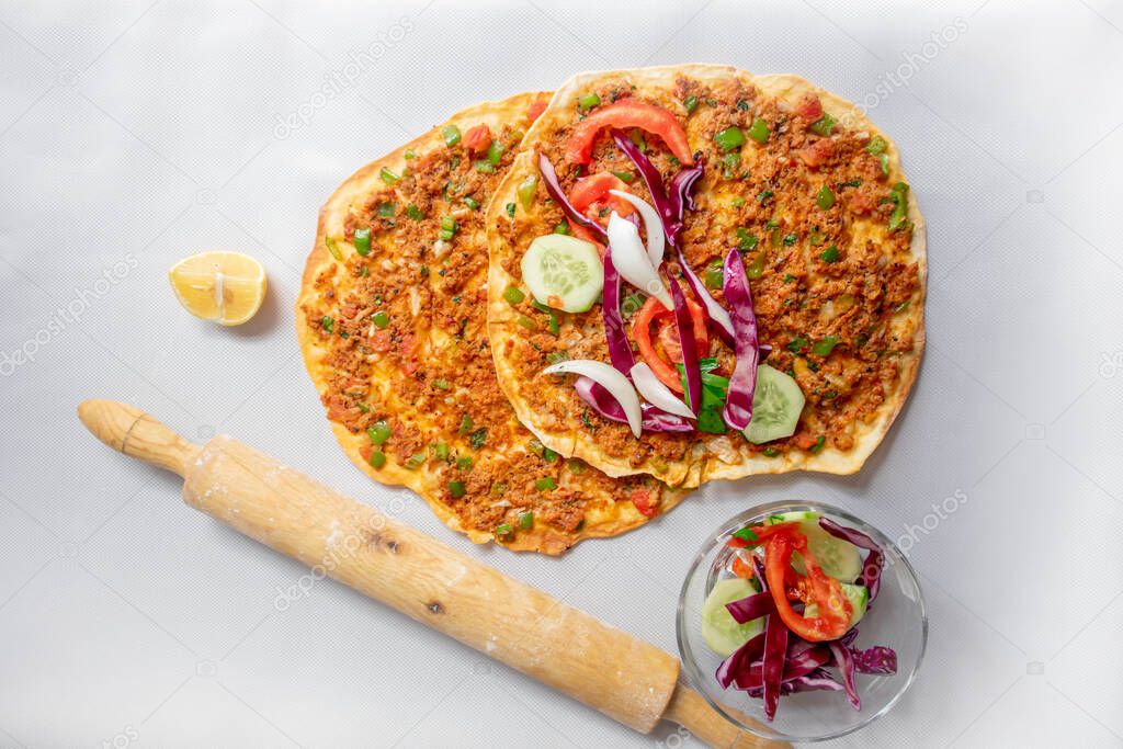 Lahmacun and appetizer on a white isolated background