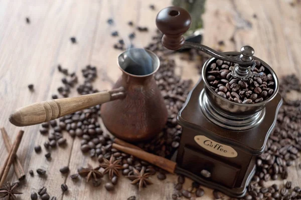 old vintage hand grinder with Coffee beans and spices