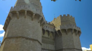 Camera tilts down  at Towers of Quart, Christian city gate Valencia.