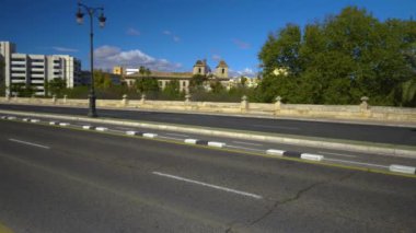 Pan to the right across an empty bridge in Valencia, Spain on an sunny day.