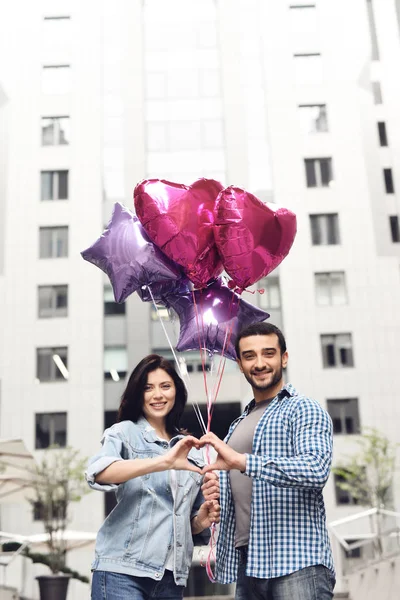 Couple Love Balloons Putting Hands Together Portraying Gesture Heart Anniversary — Stock Photo, Image