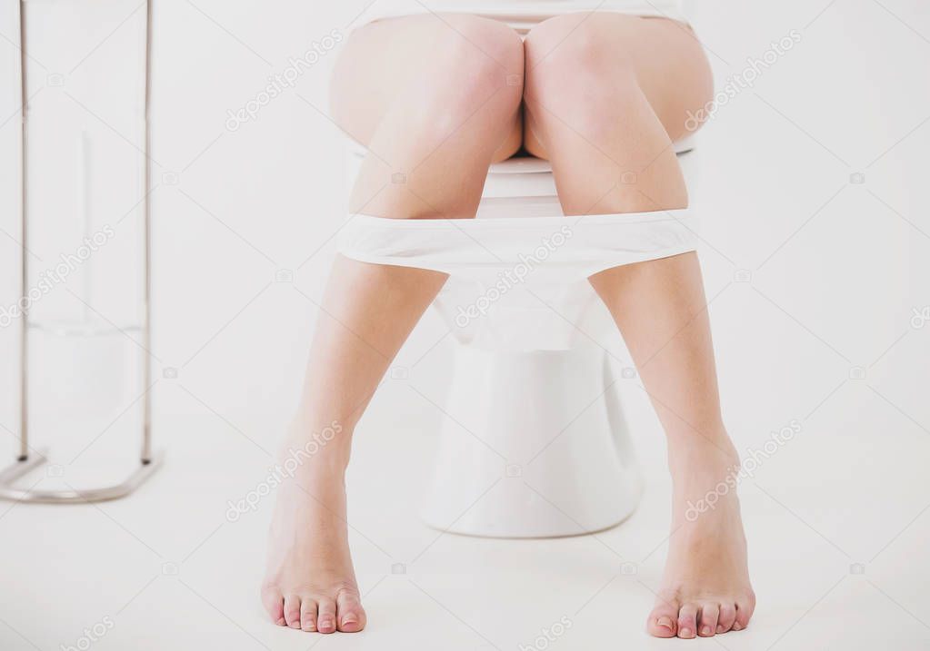 Close up.Woman in toilet in morning with panties