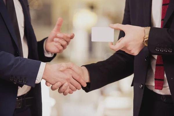 Close up.Business partners changing business cards — Stock Photo, Image