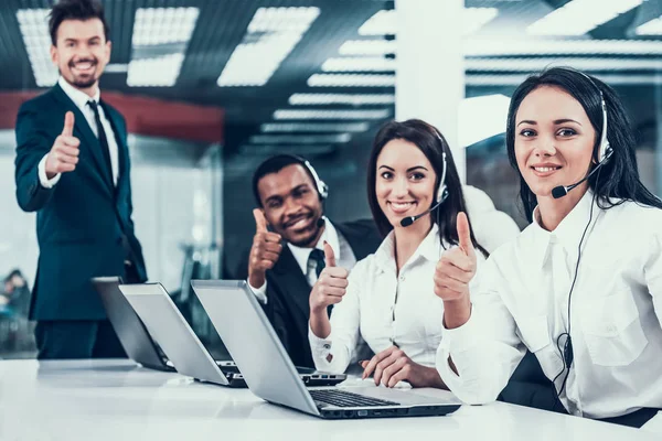 Happy multiracial call center team shows thumbs up — Stock Photo, Image