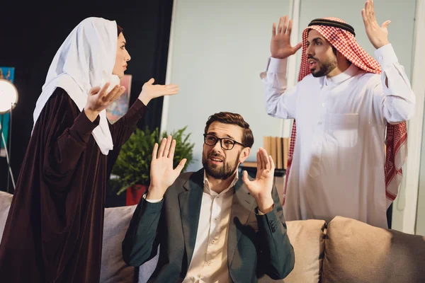 Arab couple at therapist reception quarrel. family quarrel. concept of psychotherapist