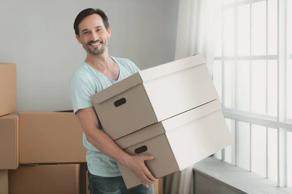 Young Bearded Guy with Cardboard Boxes in Hands. — Stock Photo, Image