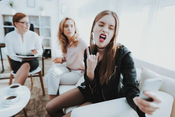 Teenage Girl in Leather Jacket with Upset Mother Taking Selfie in Psychologist Office. Punk in Lather Jacket. Puberty Problems. Conflict in Family. Communication Concept. Psychotherapy Concept.