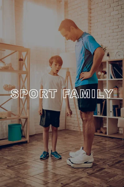 Father And A Son Are Weighing. Sport Concept. Healthy Lifestyle. Active Family. Happy Childhood. Weight Measurement. Look On Scale. Gym Clothes. Arms Akimbo. Exercising At Home. Holiday Leisure.