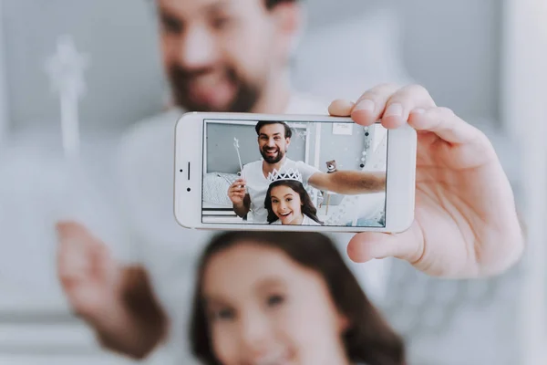 Cute Little Daughter and Daddy making Selfie. Happy Father\'s Day Concept. Father with Daughter Spending Time Togetherness at Home. Happy Family Daughter Laughs on Holiday