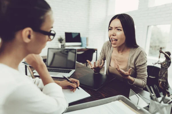 Young Upset Woman in Office with Lawyer in Glasses. Frustrated Woman. Problem in Relationship between People. Modern Law Office. Angry Young Woman. Marriage Problem. Young Advocate.