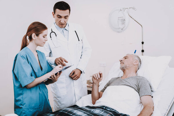 Clinic and Doctor with Patient. Old Man in Hospital. Clinic and Doctor with Patient. Old Man in Hospital. Aged Man Lies in the Medical Ward. Diagnosis and Doctor. Rehab in Hospital. Nurs and Patient