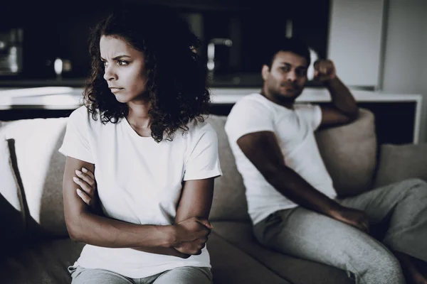 Afro American Couple On Couch. Quarrel Concept. Family Misunderstanding. Disappointed Sweatheart\'s Disharmony. Unhappy Female Deny. Couple Unhappy Holiday. Arms Akimbo. Broken Heart.
