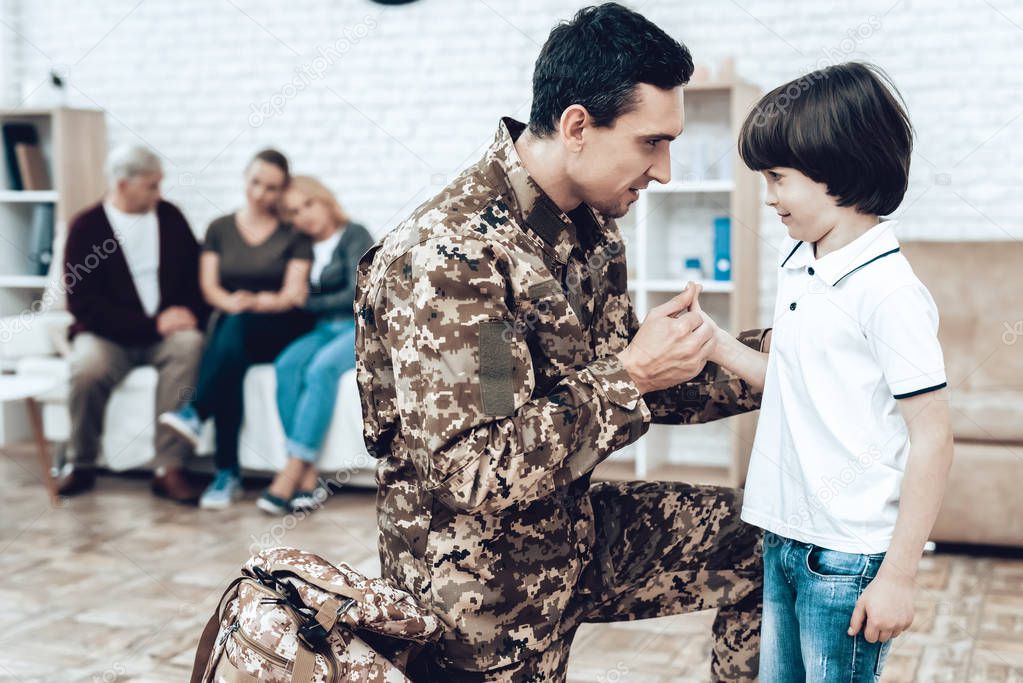 A Man Goes To Military Service. Saying Goodbye. Leaving To Army. Farewell With Family. Camouflage Uniform. Son Hanging. Feelings Showing. Guard Of Peace. Patriotic Decision. Soldier Emotion.