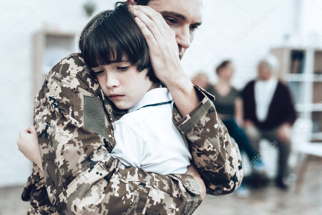 A Man Goes To Military Service. Saying Goodbye. Leaving To Army. Farewell With Family. Camouflage Uniform. Son Hanging. Feelings Showing. Guard Of Peace. Patriotic Decision. Soldier Emotion.