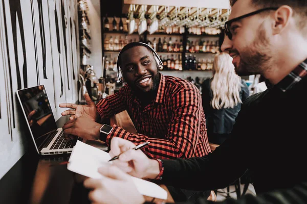 Two Guys. Sit. Bar. Computer. Group of Young People. Rest. Alcoholic Beverages. Have Fun. Together. Joyful. Chin-chin. Leisure Time. Nightlife. Positive. Emotion. Clubbing. Guys. Laptop.