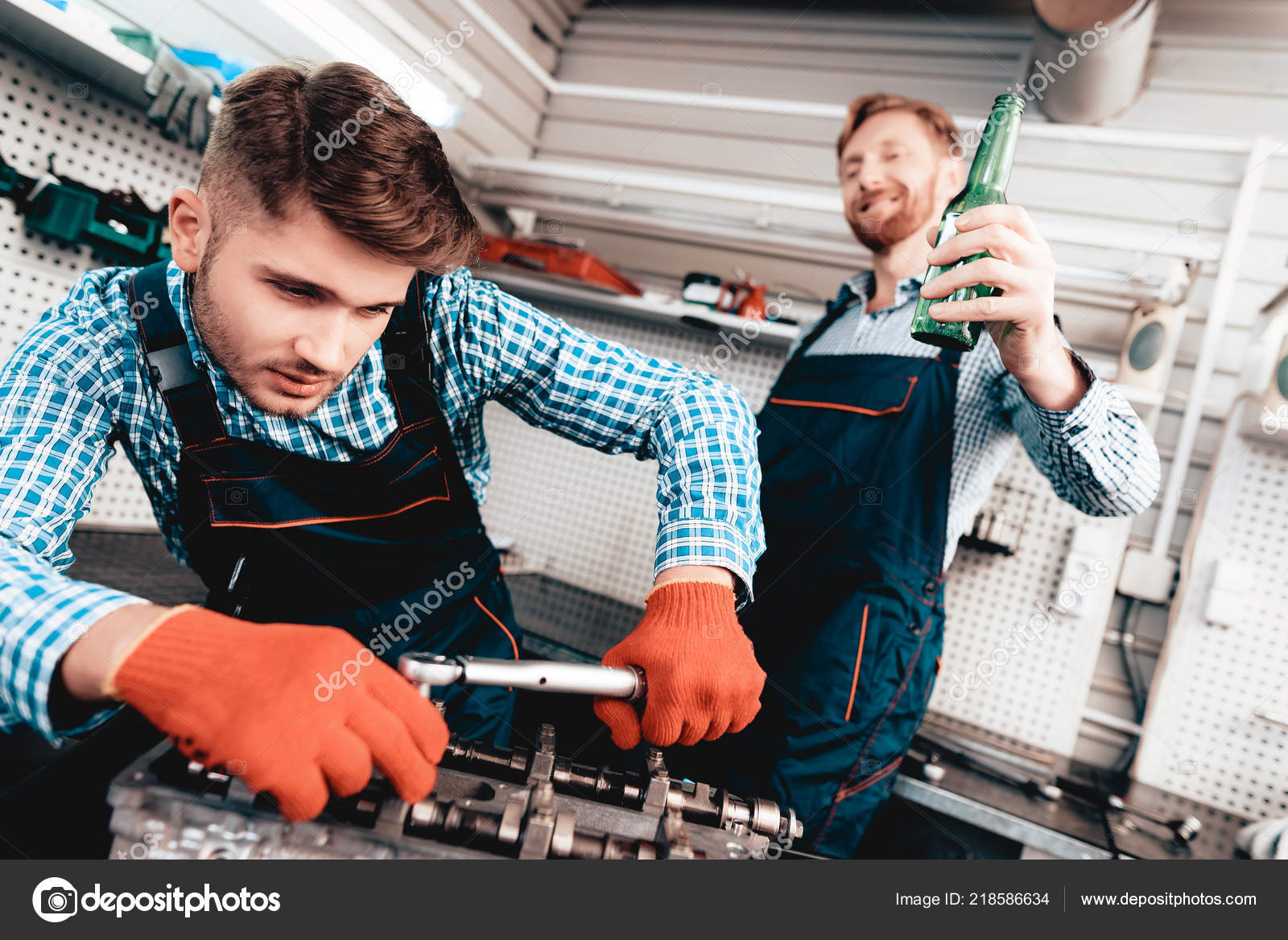 Young Auto Mechanic Checking Detail Garage Professional Uniform