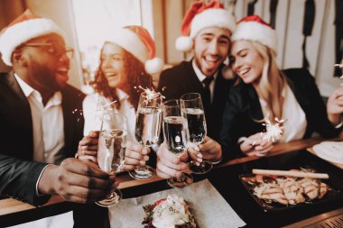 Santa's Hat. Nightlife. Young People. Rest. Bar. Girls and Guys. Drink Alcoholic Beverages. Different Races Communicate. Have Fun. Together. Clubbing. Joyful. Chin-chin. Leisure. Positive. Emotion. clipart