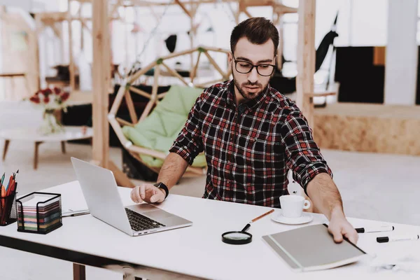 Folder. Project. Laptop. Sit. Brainstorm. Young Guy. Businessman. Work. Office. Creative Worker. Ideas. Businesspeople. Workplace. Inspiration. Stress. Relaxation. Hobby. Comfortable Office.