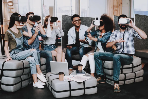 Padded Stools. Virtual Reality Glasses. Look.  Designers. Young Specialists. Choose Colors for Design. Teamwork. Discussion. Brainstorming. Design Studio. Multi-Ethnic. Project. Creative. Workplace.