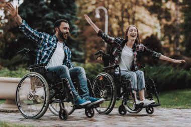 Disabled People on Wheelchairs Have Fun in Park. Disabled Young Man. Woman on Wheelchair. Relaxing in Summer Park. Fun in Summer Park. Recovery and Healthcare Concepts. Cheerful People. clipart