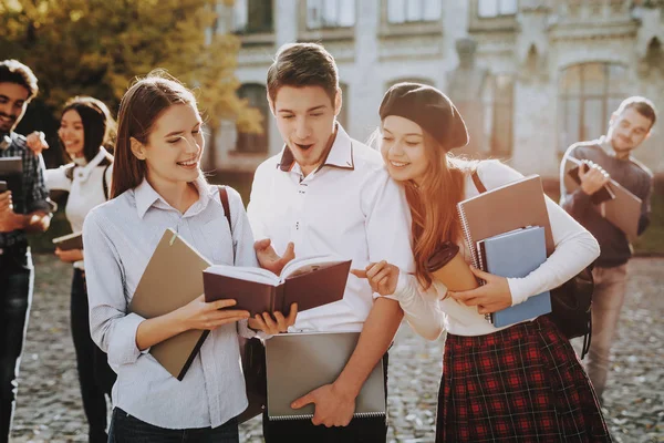 Holding Books Two Girls Boy Knowledge Standing University Together Courtyard — Stock Photo, Image
