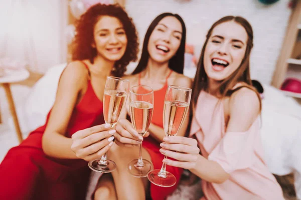 Glasses Champagne. Celebrating Women\'s Day. Emotional Young Women. Cheerful Women. Beautiful Girl. Womans Emotion. Champagne in Hands. International Women with Champagne. White Interior. Murch 8.