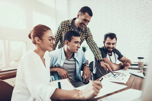 Young Workers Have Conversation in Modern Office. Brainstorm at Work. Smiling Woman. Man on Wheelchair. Smiling Manager. Teamwork in Office. Young Worker. Sitting Man. Communication with Colleagues.