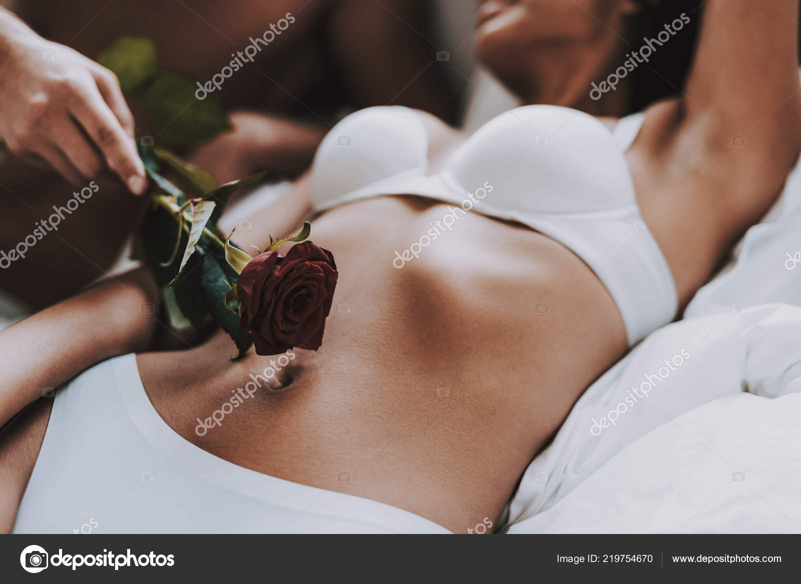 Closeup Man Caresses Beautiful Woman Using Rose Young Beautiful Couple Stock Photo by ©vadimphoto1@gmail 219754670