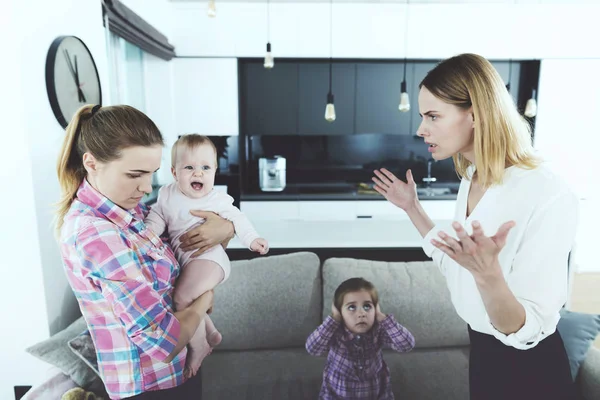 Mother Babysitter Have Fight Living Room Young Caucasian Nanny Holding — Stock Photo, Image