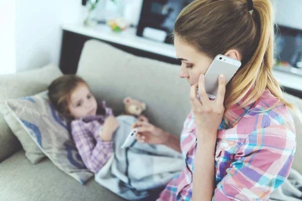 Mother Check Child Temperature Calls Doctor Attentive Careful Woman Sits — Stock Photo, Image