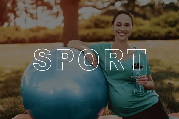 Bottle. Pregnancy Yoga. Healthy Lifestyle. Woman. Coach. Balls for Yoga. Smiling. Exercise. Sportswear. Yoga Mats. Park. Bodycare. Belly. Have Fun. Happiness. Crossfit. Mom. Parenthood.
