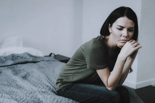 Portrait Sad Dark Haired Woman Sits Bed Gloomy Caucasian Frowning — Stock Photo, Image