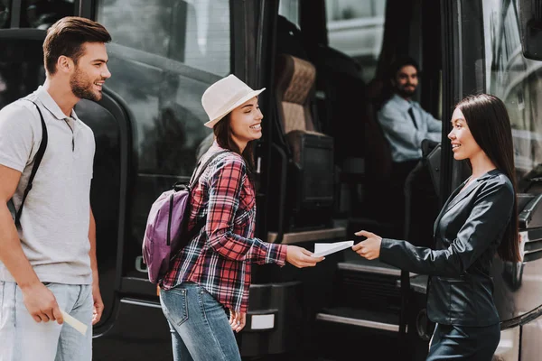 Tour Service Worker Taking Tickets Passengers Young Smiling People Backpacks — Stock Photo, Image