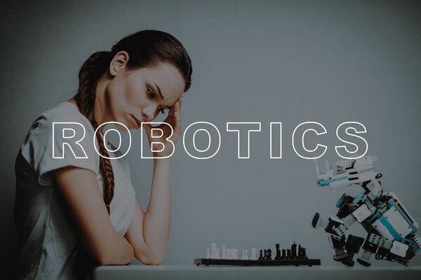 Think. Chessboard. Play. Move. Woman's Hand. Small. Robot. Stand. Design. Digital. Happiness. Happy. Home. House. Interior. Machine. Relationship. Technology. Mechanical. Innovation. Smile.