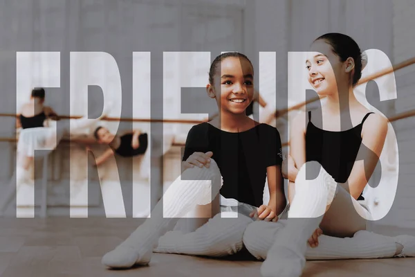 Break during Ballet Class. Mixed Race and Caucasian Kids Smile and Talk. Children in Ballet Wear at Professional Dance Class. Kids Sit on a Floor. Friends at the Dance Studio. Transparent Text.