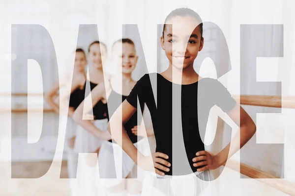Happy Mixed Race Children in a Dance Studio. Adorable Little Girls Look at You. Ballerinas Practicing Ballet at Class. Ballet Barre Exercises. Kids in Bright Dance Room. Concept of a Beautiful Dance.