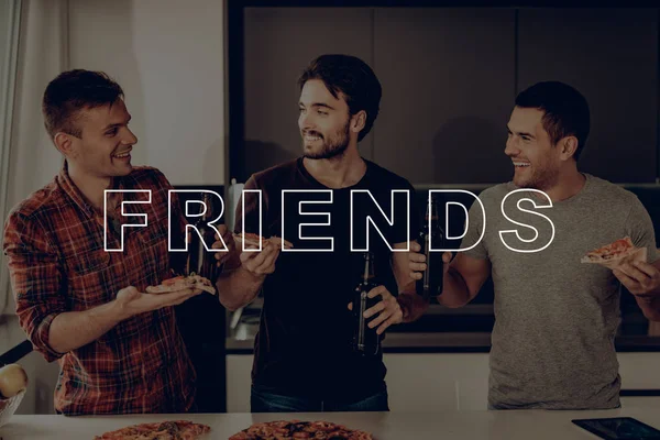 Eat Pizza. Kitchen. Friend. Talk. Cheerful. Three Men. Drink Beer. Dark Bottles. Smiling. Posing for Photo. Party. Guys. Best Friend. Happy Together. Celebration. Having Fun. Spend Time Together.