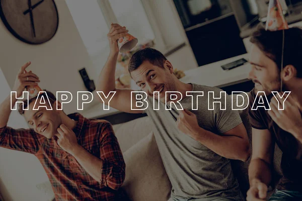 Happy Birthday. Men. Put On. Birthday Hat. Prepar Party. Guys. Sit on Couch. Best Friend Forever. Happy Together. Celebration. Gifts. Friend. Having Fun. Spend Time Together. Cheerful.