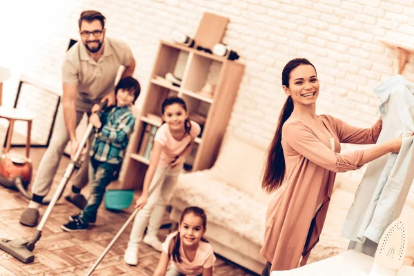Happy Cute Smiling Big Family Cleaning Room. Mother with Kids Washing at Home. Cleaning Day Concept. Kids Helping House Chores. Parent Concept. Domestic Concept. Togetherness Cleaning.